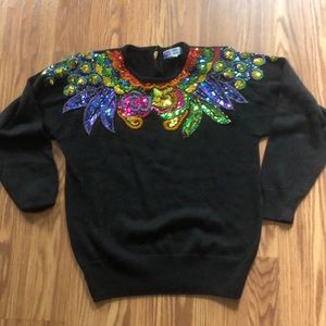 Black sweater embellished with colored sequins and beads
